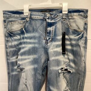 Ladies AMIRI Faded Blue Distressed Denim Jeans size 38/18